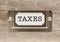 Taxes Metal File Cabinet Label Frame on Wood