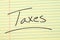 Taxes On A Yellow Legal Pad