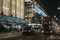 Taxi and bus on Oxford Street, London, UK, in from of House of Fraser and John Lewis malls decorated with Christmas lights