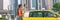 Taxi cab mobile phone app Asian business woman walking on street hailing a car for a ride using smartphone panoramic