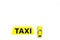 Taxi concept. Yellow service sign text taxi near car toy on white background top view copy space