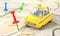 Taxi concept. Yellow taxi with pin on a city map with blur.