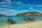 Taxi long-tail boats docked on the tropic beach