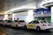 Taxi rank at Frankfurt airport in Germany, white cars with yellow signs at the entrance are waiting for air passengers who have