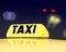 Taxi sign at night