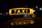 Taxi sign at night , taxi cars