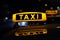 Taxi sign at night , taxi cars