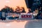 Taxi sign on the roof of taxi cab on the busy street over yellow orange warming sunset background.