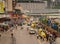 Taxi stand with plenty of people and businesses downtown Chongqing, China