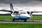 Taxiing a turboprop passenger aircraft at a rural airfield in cloudy summer weather