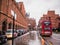 Taxis and bus on rainy street outside St Pancras Station, Bloomsbury, London