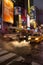 Taxis and buses pass by on busy street at Times Square, Manhattan