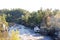 Taylors Falls Minnesota Paddleboat on the St. Croix River in the fall with fog lifting from the cliffs