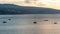 Tbilisi sea and boat with deflated sails. Sunrise