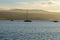 Tbilisi sea and boat with deflated sails. Sunrise