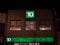 TD Bank logo in front of their local branch in West Toronto, Ontario at night.