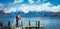 Te Anau, New Zealand, October 5, 2019: Gorgeous image of a european and caucasian couple on the pier of Lake Te Anau with the snow