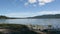 Te Anau townscape with the lake near, trees, clear, sunlit sky background