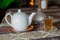 Tea in Azerbaijani traditional armudu pear-shaped glass . Azerbaijan black tea .white sugar cubes . White kettle and sugar bowl .