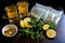 tea bags, lemon, and mint leaves arranged for iced tea preparation