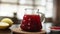 Tea being poured into glass transparent tea cup. Cup of tea. Sweets, hot tea and teapot. Ceramic teapot and glass teacup