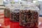 Tea blends in glass jars on the counter of the cafe. Bright colors of tea