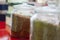 Tea blends in glass jars on the counter of the cafe. Bright colors of tea