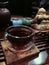 The tea ceremony, dark small glass cup of tea