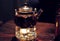 Tea ceremony, tea leaves in boiling water in a glass pot on a wooden table