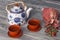 Tea ceremony, tea party. Cups, honey, sugar and vintage cloth sa