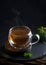 Tea concept, teapot with tea surrounded on wood background