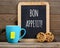 Tea, cookies and blackboard with Bon appetit wishes