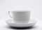 Tea couple on a white background. Porcelain service close-up. A teacup and saucer
