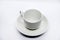 Tea couple on a white background. Porcelain service close-up. A teacup and saucer