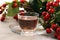 Tea. cup of herbal Dog rose tea with bunch branch Rosehips, type