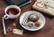 Tea cup with a homemade tea bag, sweets - cake, cookies and homemade candy, homemade Valentine\'s day gift in kraft paper and table