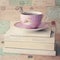 Tea cup over books