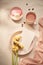 Tea cup with Rose tea and fresh  flower and macarons on white background