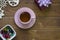 A tea cup with saucer, a bowl of candies and a giftbox