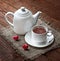 Tea cup and teapot with red hearts