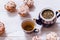 Tea cups, teapot and muffins on white wooden table, set teapot and brewed tea with cakes on table, green black herbal hot beverage