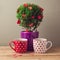 Tea cups and tree plant with heart shapes for Valentine\'s day celebration