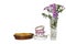 Tea cups, white bread in a basket and flowers