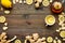 Tea for cure colds. Cup, teapot, ginger root and lemon on dark wooden background top view copy space