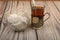 Tea in a faceted glass in a vintage Cup holder and tea bags in a glass vase on a wooden background. Close up