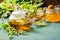 Tea with fresh leaves of lemon balm mint cup and teapot on a rustic background. Healing herbal drink. Horizontal frame.