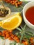 Tea with fruits of sea buckthorn and oranges