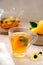 Tea in glass cup with lemon, mint and honey. Delicious fruit, herbal teapot and cup