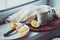 Tea with lemon slices on wooden plate, vintage toned