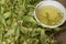 Tea from linden. Fresh flowering linden on a wooden background. Healthy and natural tea. June linden harvest. Healthy